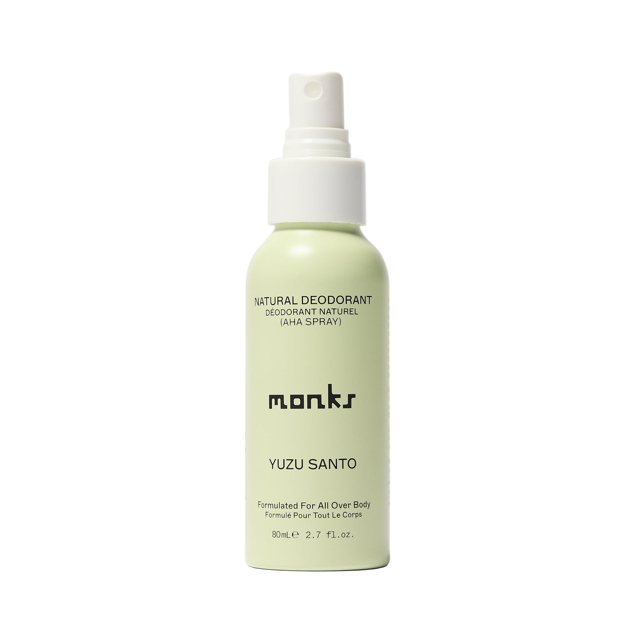 Green deodorant spray bottle labeled 'monks Yuzu Santo' on a white background